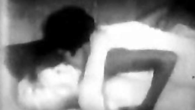 Black and white video of an interracial lesbian scene