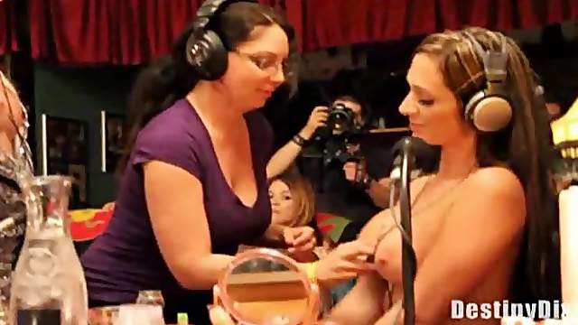Ladies suck on tits on a radio show