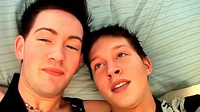 Hot young guys look sexy kissing in bed