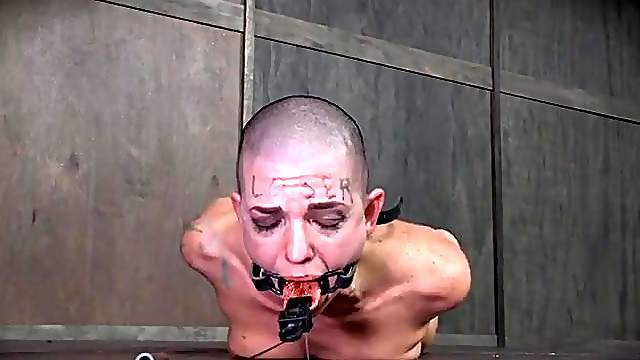 Dripping fiery hot sauce on the tongue of a BDSM slave