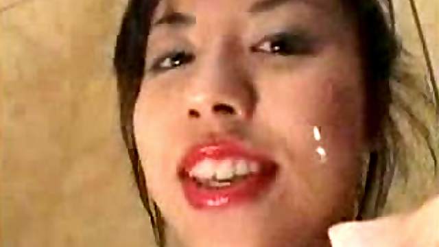 Asian chick kisses and licks camera
