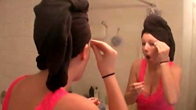 Busty girl does her makeup after shower