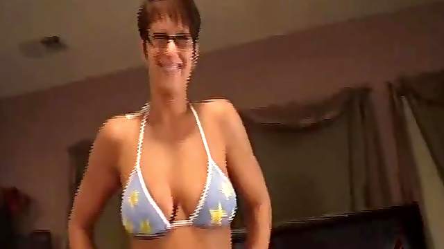 Nerdy chick in a bikini sucks a hard dick